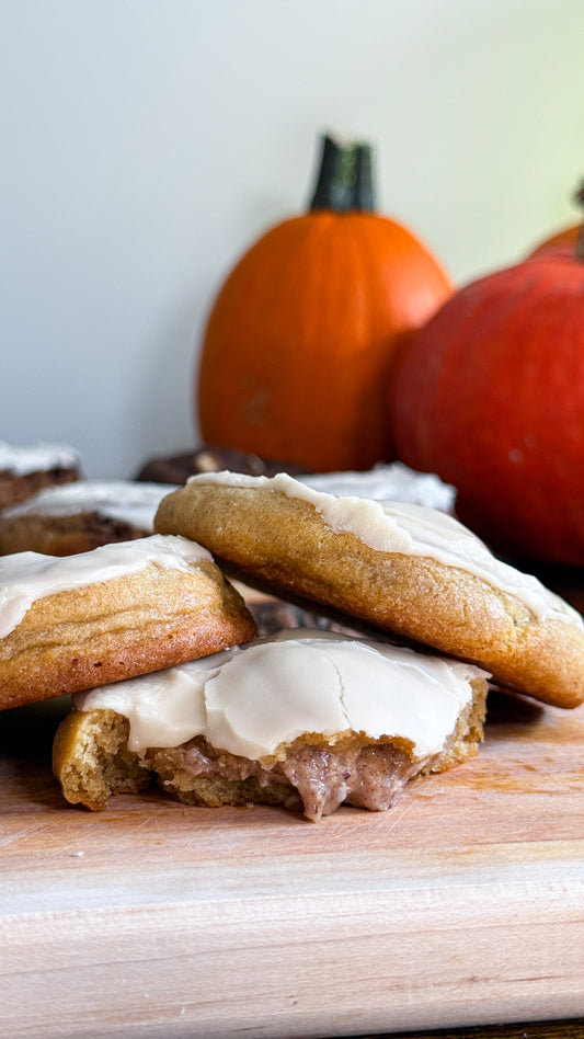 Tragically Dipped cookie cut open to show the pecan butter filling