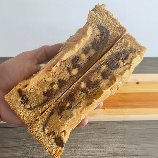 The PB Cup Beast from The Bearded Baker. Decadent peanut butter cup filling paired with Nutella, chocolate chips and peanut butter chips in a soft cookie dough
