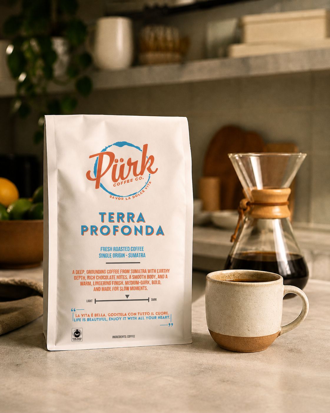 a bag of PÜRK Coffee Co.'s Terra Profonda single origin coffee from Sumatra sitting on a kitchen counter beside a fresh brewed cup of coffee